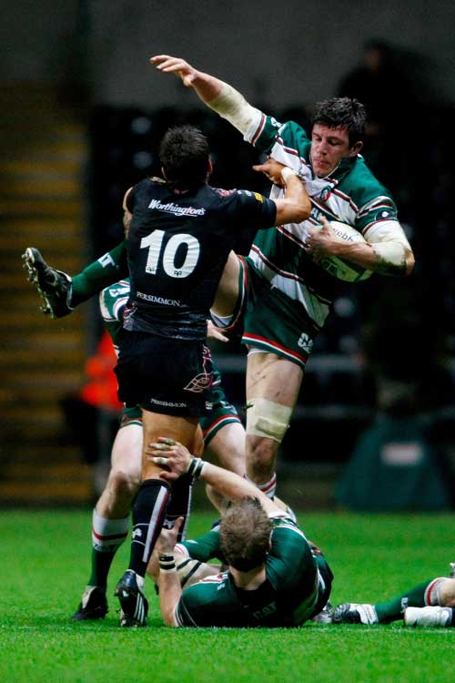 The Ospreys' James Hook pushes Leicester's Martin Corry