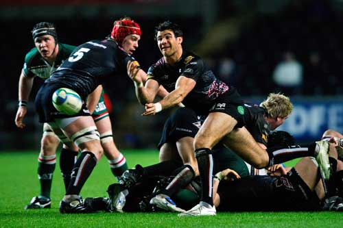 The Ospreys' Mike Phillips makes a pass