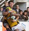 Serge Betsen is tackled by Lionel Nallet
