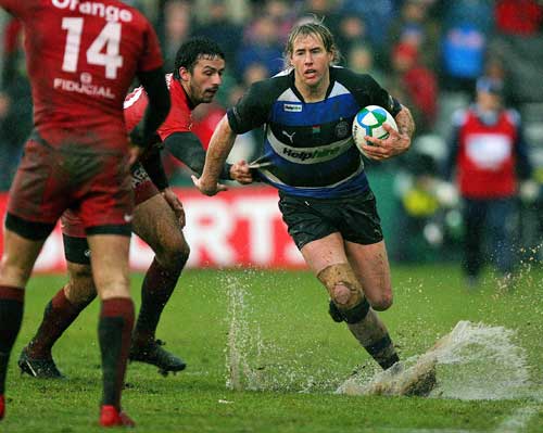 Bath fly-half Butch James evades Toulouse's Clement Poitrenaud