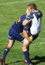 The Brumbies' Pat McCabe take a tackle