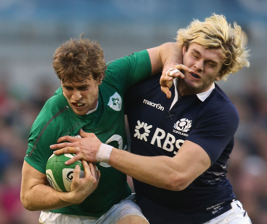 Andrew Trimble holds off Richie Gray 