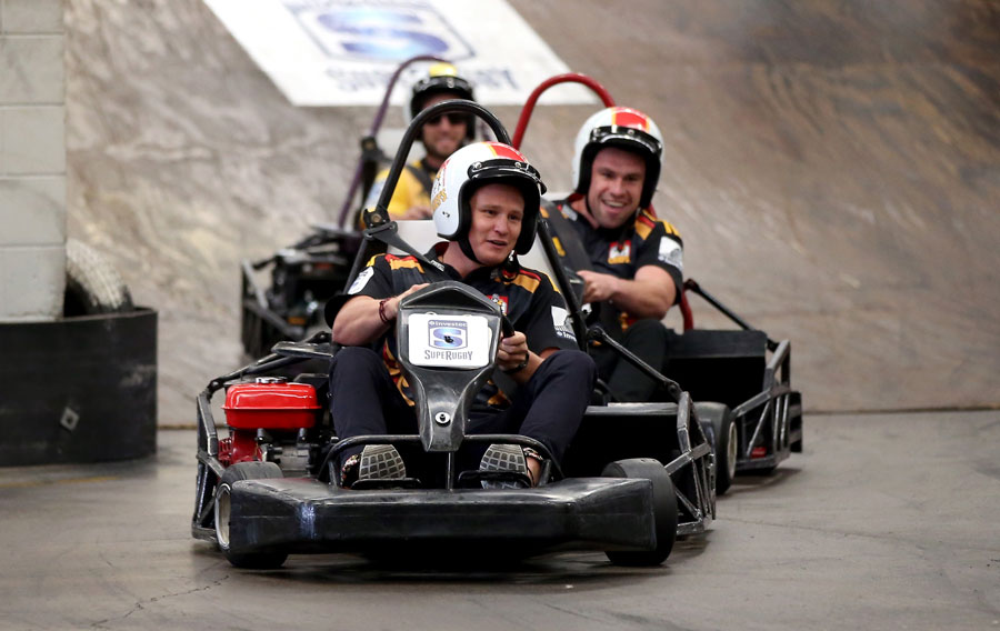 Robbie Robinson leads Tom Marshall and Cory Jane on a carting track  during the Super Rugby Season launch