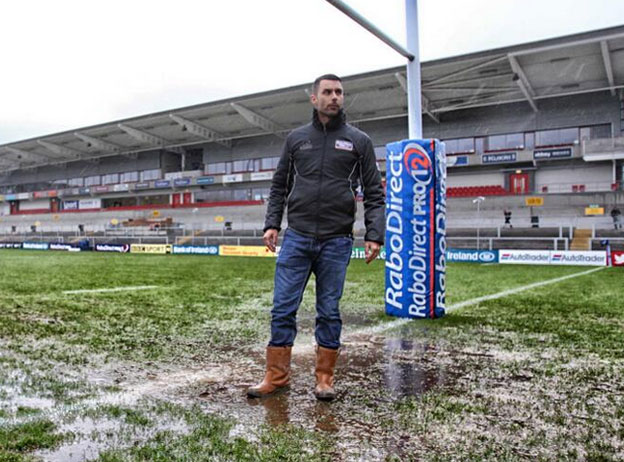A groundsman inspects the pitch at Ravenhill