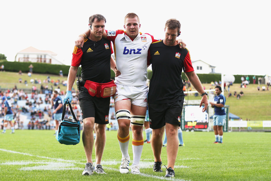 Sam Cane is helped off the field after suffering a knee injury, Super Rugby trial, Chiefs v Blues, Rotorua, New Zealand, Friday 14, February