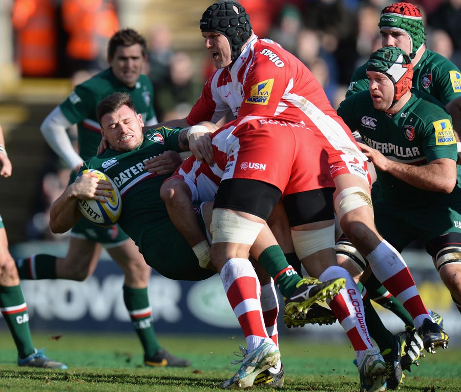 Adam Thompstone is sent crashing to earth by Gloucester's Sione Kalamafoni