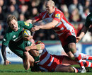 Mike Tindall and Mike Wood bring down Leicester's Mathew Tait
