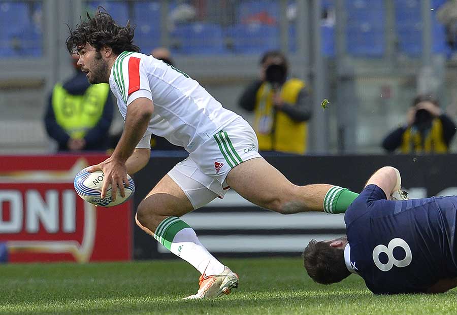 Italy's Luke McLean attempts to make ground against Scotland