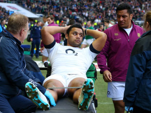 Mako Vunipola checks on his brother Billy after he hobbled off the field, England v Ireland, Six Nations, Twickenham, February 22, 2014