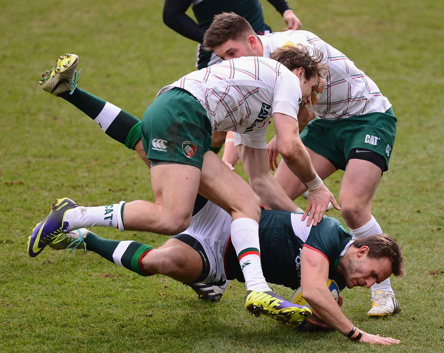 London Irish's Andy Fenby is ushered to the ground