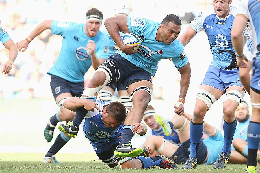 The Waratahs' Wycliff Palu busts a tackle from Brynard Stander