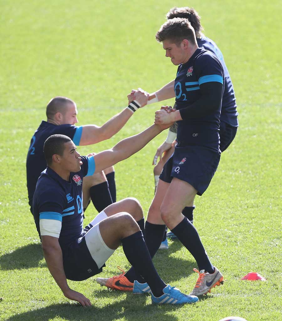 England's Owen Farrell trains with Luther Burrell