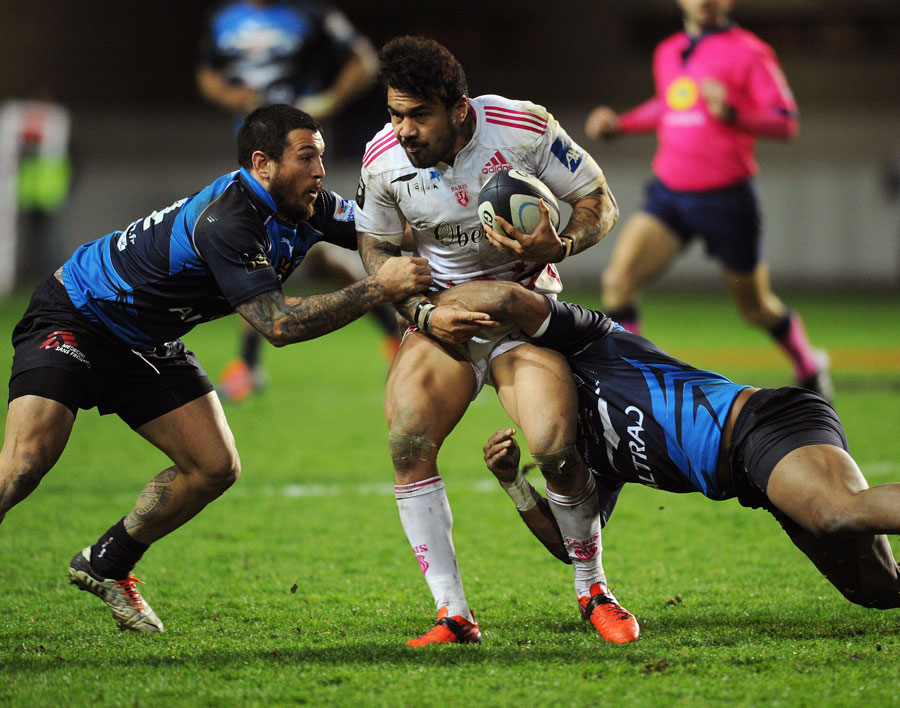 Montpellier's Alex Tulou is stopped in his tracks by two Stade Francais tacklers
