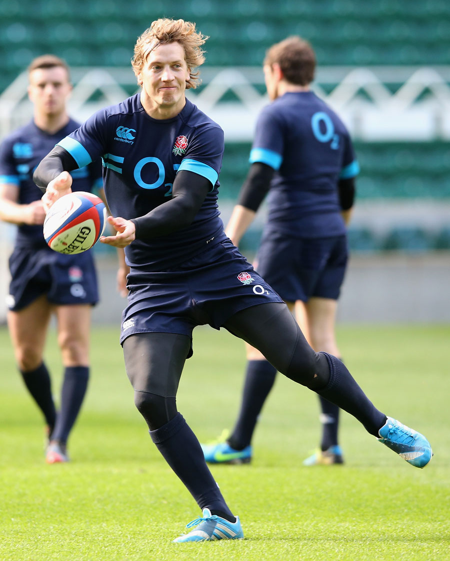 Billy Twelvetrees passes the ball during an England training session