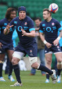 Tom Johnson passes the ball during an England training session
