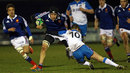 Francois Cros is tackled by Ben Chambers