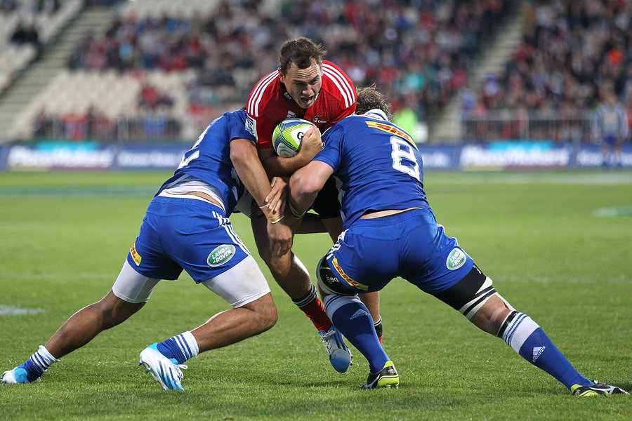 Crusaders' Israel Dagg is crushed in a two-man tackle