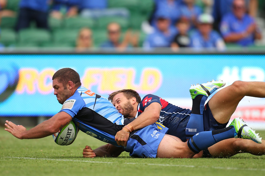 Western Force's Matt Hodgson crashes over the whitewash during his 100th match, Western Force v Melbourne Rebels, Super Rugby, March 8, 2014