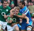 Ireland's Andrew Trimble finds it hard to get through the Italian defence