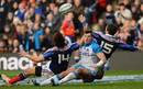 Scotland's Sean Lamont contests the high ball with the French defenders