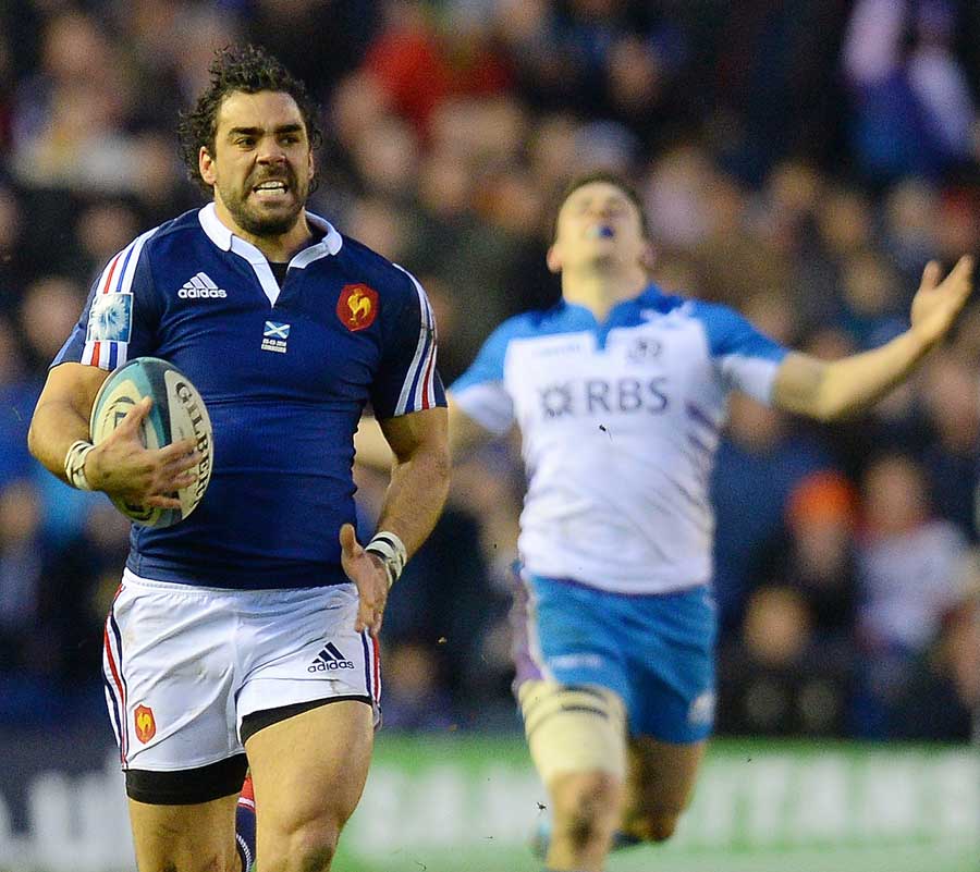 France's Yoann Huget goes the distance after taking an intercept pass