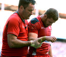 Leigh Halfpenny is led from the Twickenham field after dislocating his shoulder