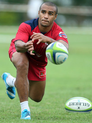 Queensland Reds' Will Genia makes a pass in training, Northwood School, Durban, South Africa, March 10, 2014