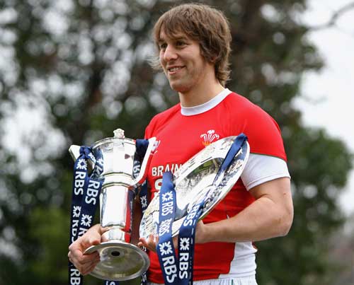 Wales captain Ryan Jones poses with the Six Nations trophy and the Triple Crown