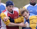 France's Aurelien Rougerie vies with centre Benoit Baby during a training session