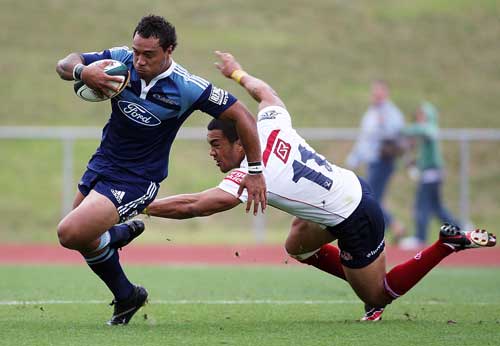 The Blues' Anthony Tuitavake evades the Reds' defence