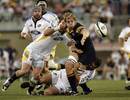 The Brumbies' Stephen Hoiles offloads the ball