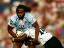 The Waratahs' Lote Tuqiri is shackled by the Fiji Warriors' defence