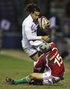 England Saxons winger Noah Cato is tackled by Portugal's Pedro Cabral