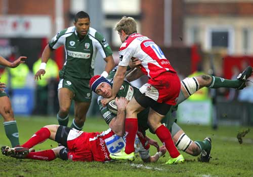 London Irish lock Nick Kennedy is tackled by the Gloucester defence