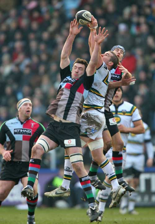 Harlequins' Tom Guest and Northampton's Mark Easter compete for a high ball