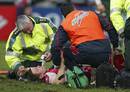 Gloucester's Dave Lewis receives treatment after breaking his ankle