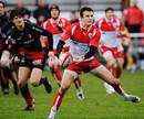 Biarritz's centre Damien Traille passes the ball