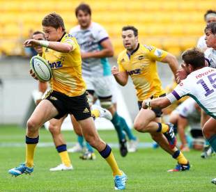 Beauden Barrett beats the tackle of Willie le Roux, Hurricanes v Cheetahs, Super Rugby, Westpac Stadium, Wellington, March 15, 2014 