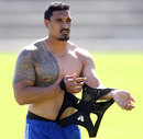 Jerome Kaino changes his jersey during a Blues training session