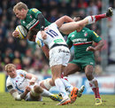 Scott Hamilton of Leicester is tackled by Henry Slade