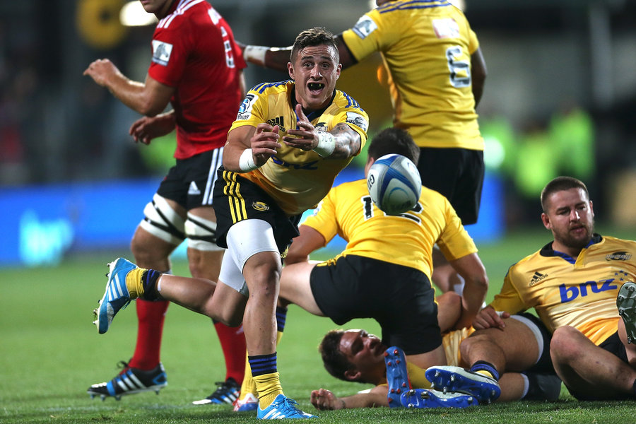 TJ Perenara fires a pass during the Hurricanes win 