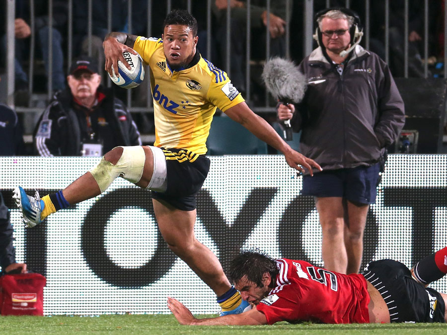 lapati Leiua of the Hurricanes skips out of the tackle of Sam Whitelock