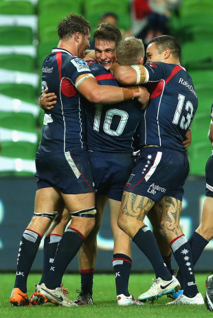 Rebels players congratulate Mitch Inman for scoring, Melbourne Rebels v Brumbies, Super Rugby, Melbourne, March 28, 2014