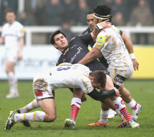 Gonzalo Tiesi  is tackled by Alex Grove and Ravai Fatiaki, Newcastle Falcons v Worcester Warriors, Newcastle, March 30, 2014 