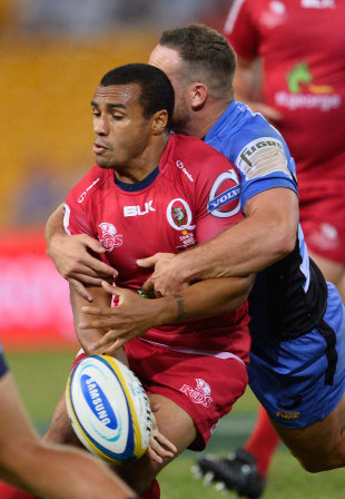 Will Genia is crunched in a tackle, Reds v Western Force, Super Rugby, Suncorp Stadium, Brisbane, April 5, 2014
