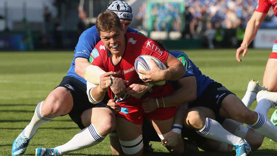 Toulon's Juan Smith is hauled down by the Leinster defence