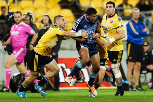 Charles Piutau of the Blues is smothered by the Hurricanes' defence, Hurricanes v Blues, Super Rugby, Westpac Stadium, Wellington, April 18, 2014