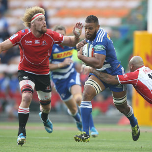 The Stormers' Nizaam Carr attempts to break a tackle, Stormers v Lions, Super Rugby, Newlands Stadium, Cape Town, April 19, 2014 