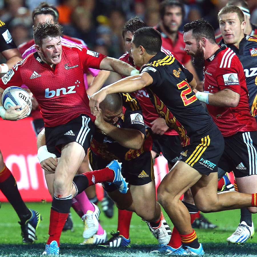 Crusaders fly-half Colin Slade takes on the Chiefs defence