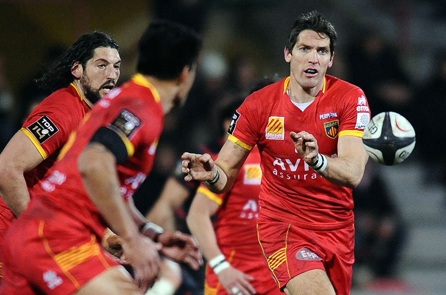 Perpignan's James Hook throws a pass against Toulouse